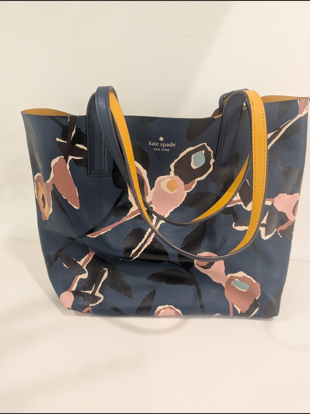 kate spade Reversible Navy Floral& Amber color with pouch
